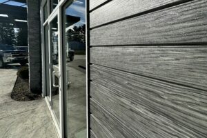 Metal Axis in Weathered Woodgrain is featured on a commercial entrance.