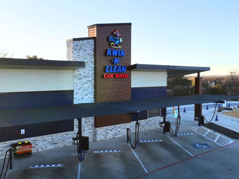 Kwik N Clean commercial car wash featuring Reveal Plank metal siding exterior