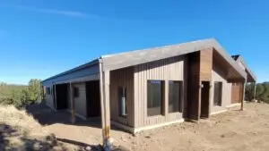 Cotapaxi, CO home featuring Textured Buckskin Metal Axis, Soffit, Reveal Plank, and Metal XL panels in Textured Mocha Brown and Western Rust XL finishes.
